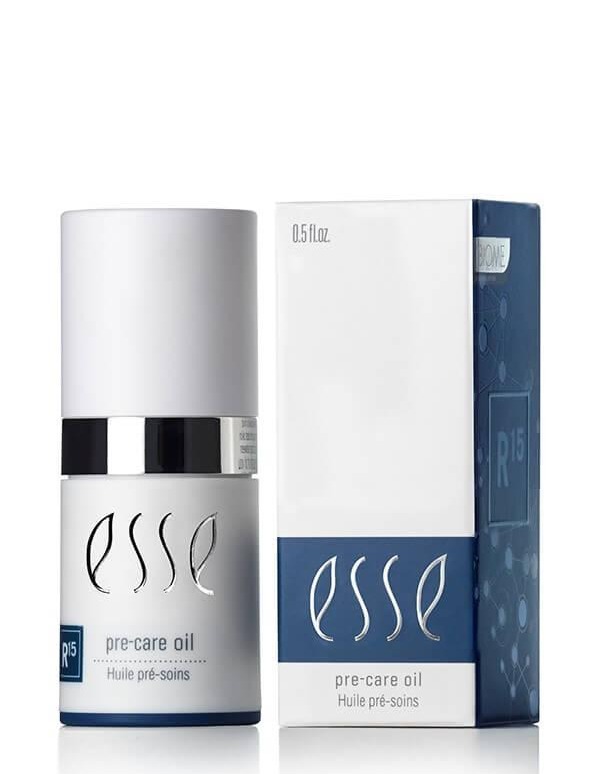 A bottle of Esse Activator is shown next to its packaging. The bottle has a silver and white design with "esse" written on it. The box is white with blue accents and also reads "esse activator." The size of the bottle is 0.5 fl oz.